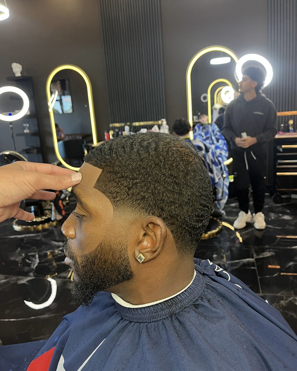 Skin fade with beard lineup by Yeremie